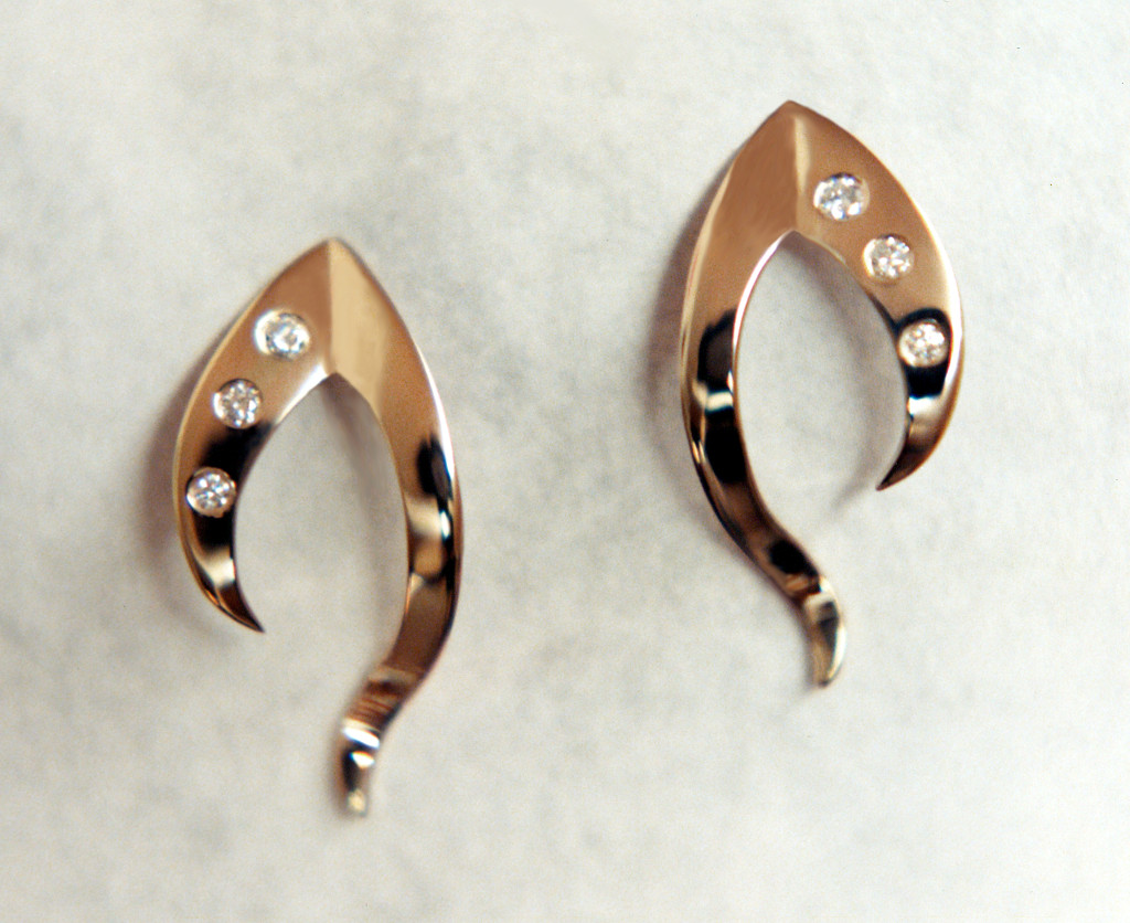 Picture of earrings freeform, cut from sheet with 3 flush set diamonds