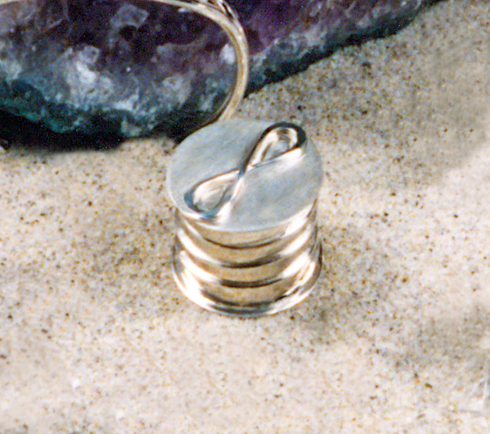 Round Sterling box with the Eternity symbol on top