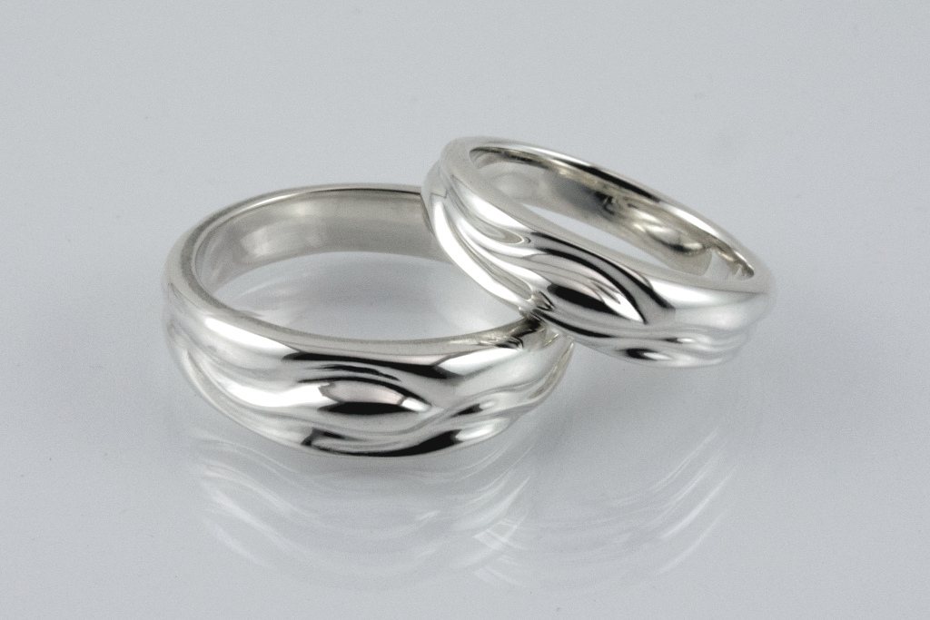 Picture of Summer Stream wedding bands in sterling, laying down